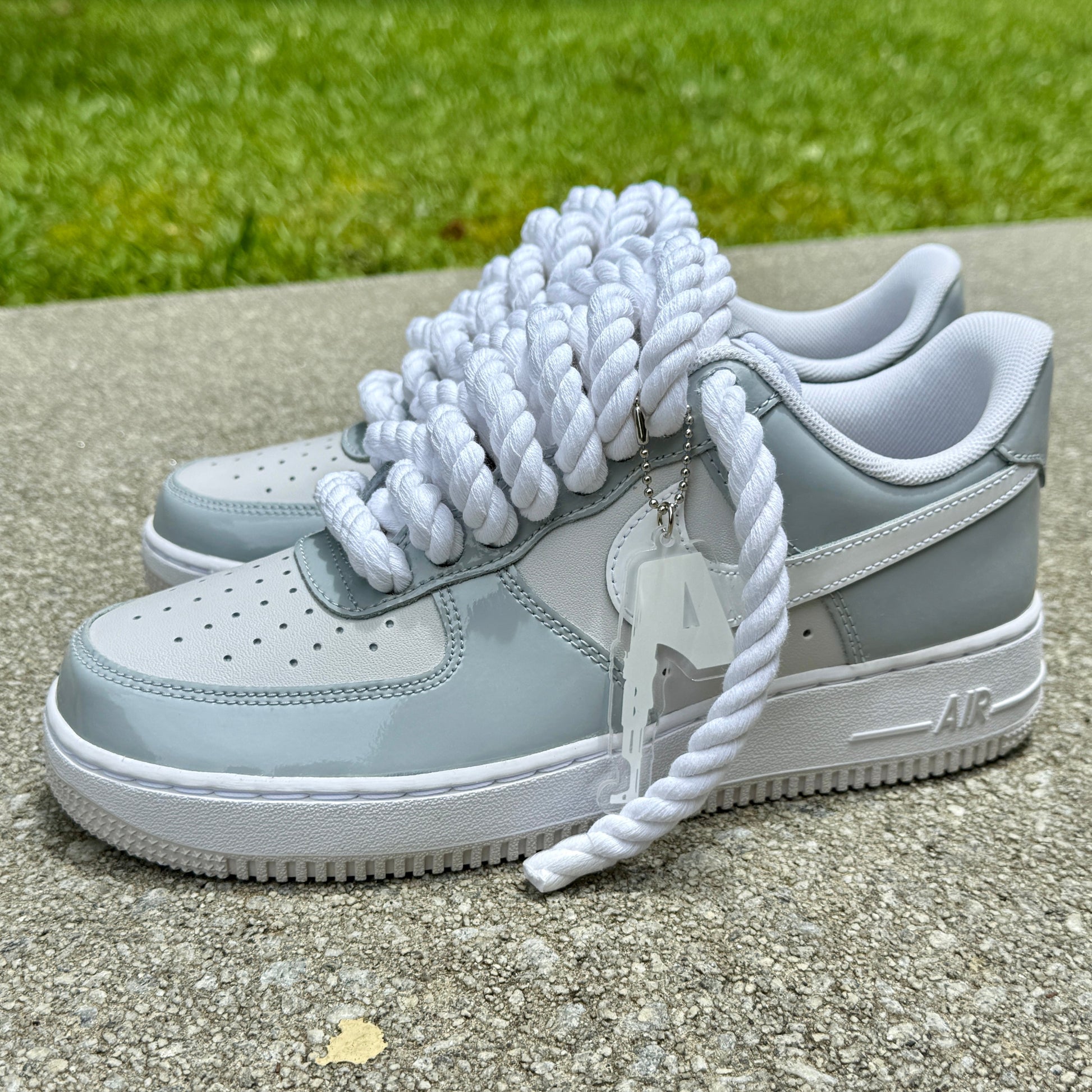 Gray patent leather and white air force 1 with white rope laces