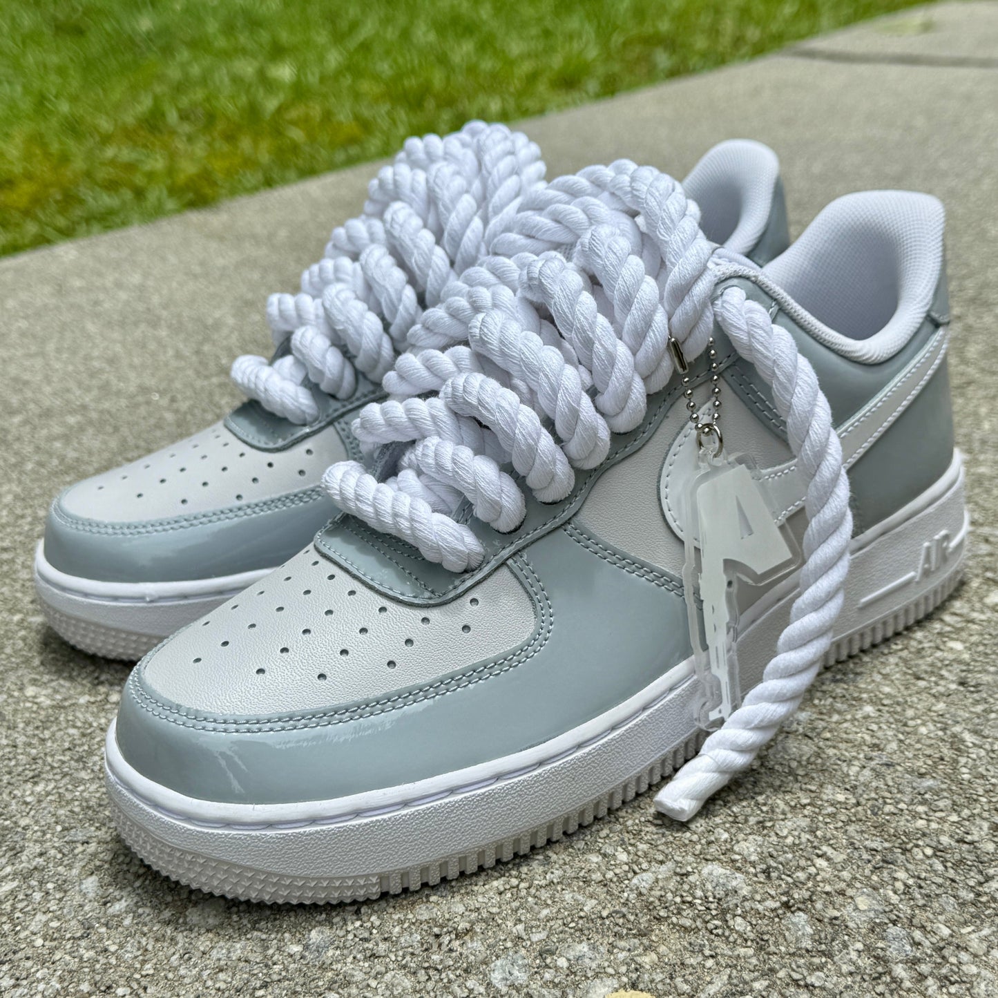 grey and white patent leather air force ones with chunky rope laces