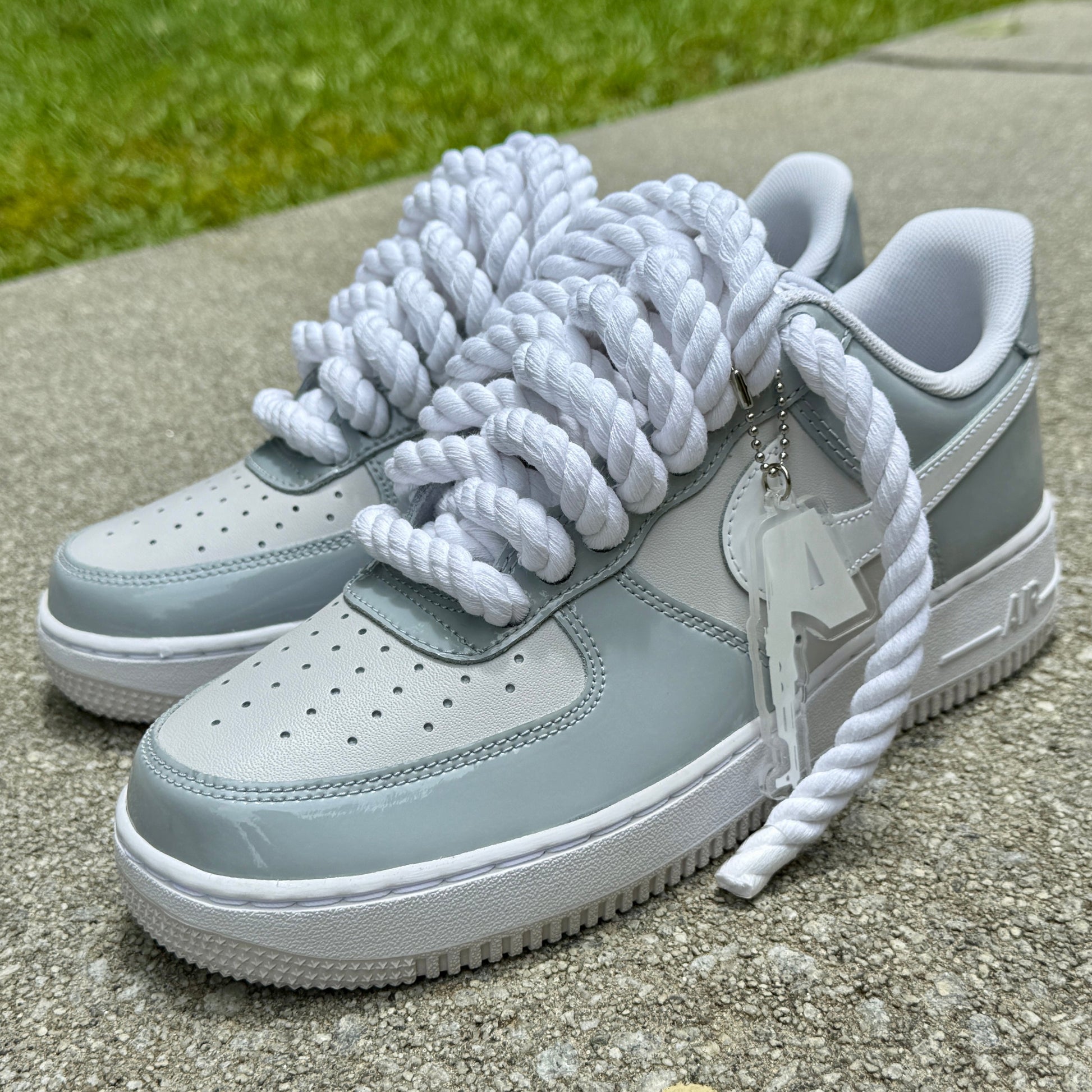 grey and white patent leather air force ones with chunky rope laces